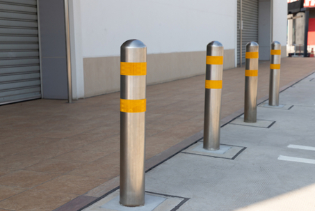 steel bollards with yellow reflec strip.