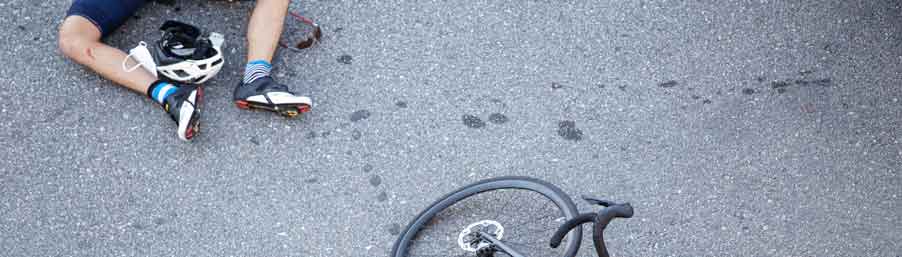 cyclist on the road after accident